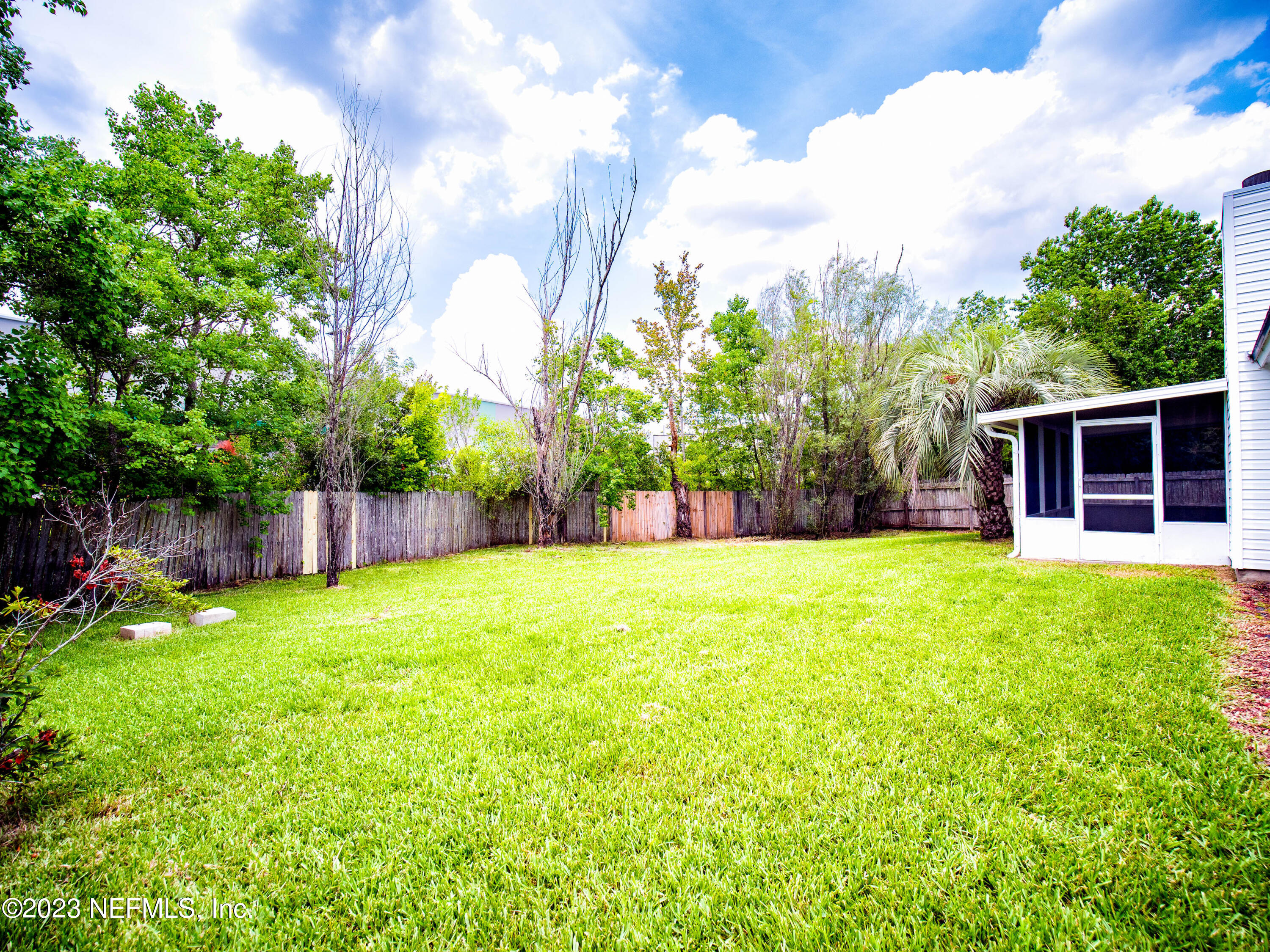 3252 Dowitcher Lane Orange Park, FL 32065 - Photo 23 of 25 a view of a backyard with a garden