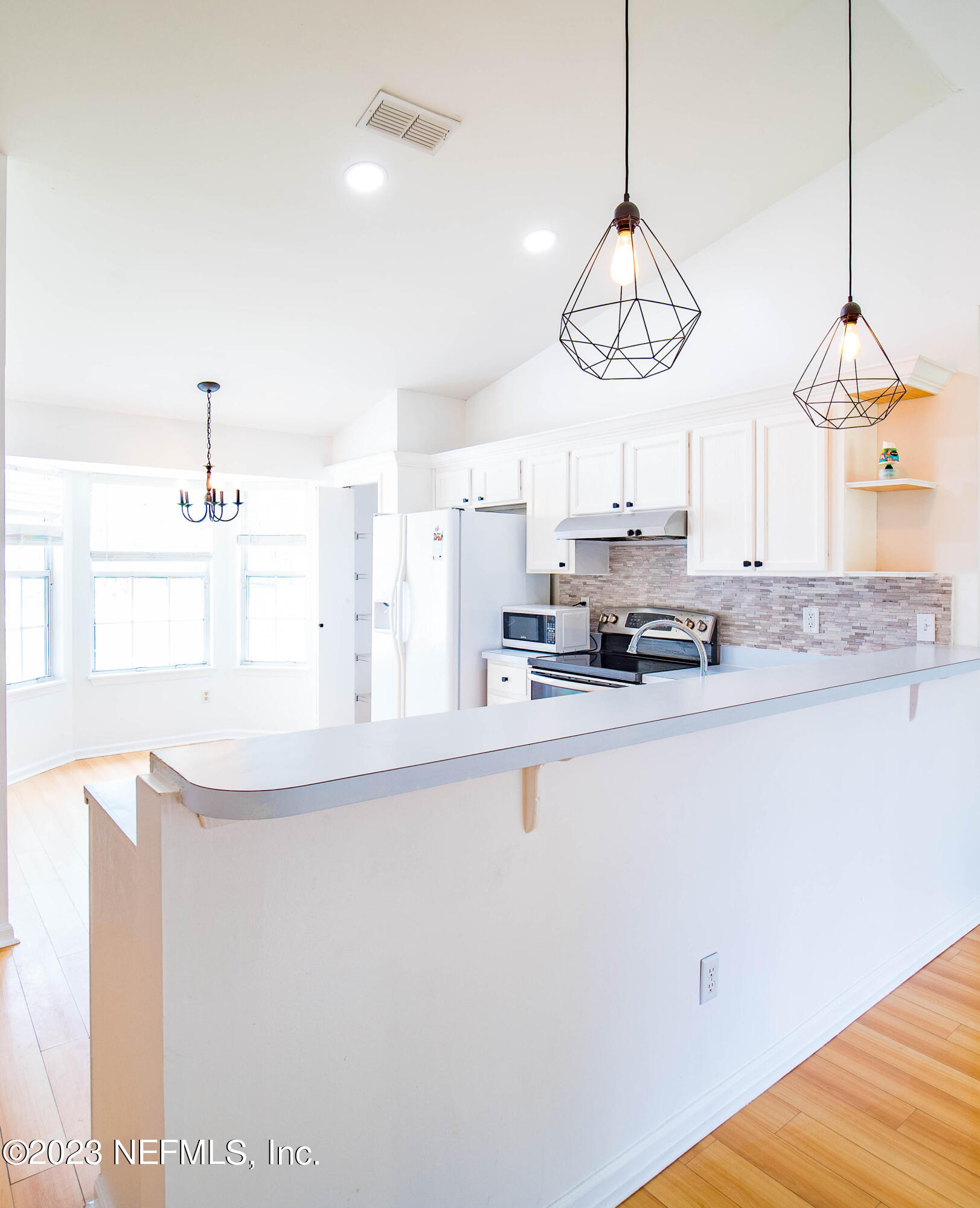 3252 Dowitcher Lane Orange Park, FL 32065 - Photo 9 of 25 a kitchen with stainless steel appliances granite countertop a sink a stove and a granite counter tops