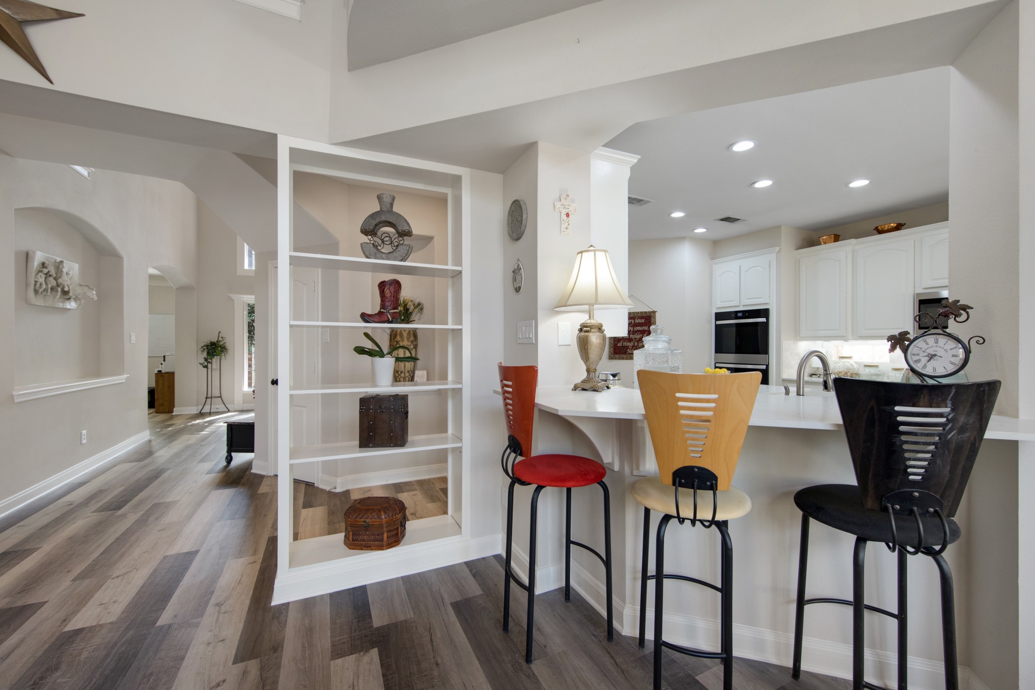 9510 Ashdown Forest Drive Spring, TX 77379 - Photo 15 of 50 KITCHEN – spacious breakfast bar with seating offers the perfect spot for casual meals or conversation while cooking. The open design connects the kitchen seamlessly with the main living areas.