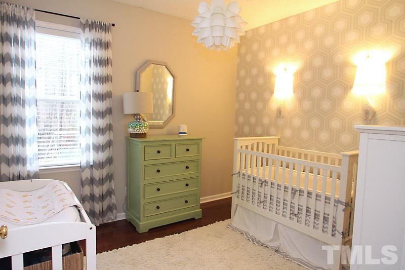 1002 Shackleton Road Apex, NC 27502 - Photo 10 of 19 Cute secondary bedroom with hardwood flooring