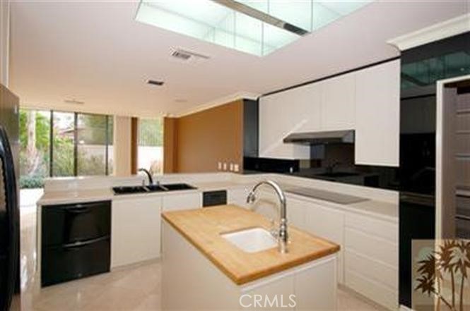 44 Mt Holyoke Drive Rancho Mirage, CA 92270 - Photo 5 of 6 a kitchen with granite countertop a sink a counter top space and cabinets