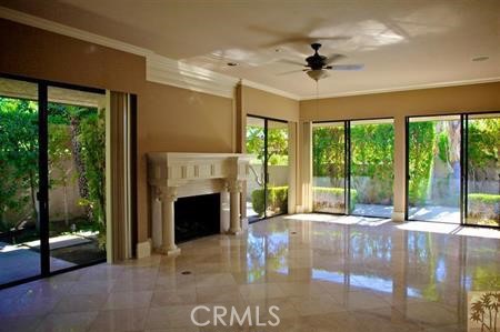 44 Mt Holyoke Drive Rancho Mirage, CA 92270 - Photo 6 of 6 a living room with fireplace furniture and a floor to ceiling window