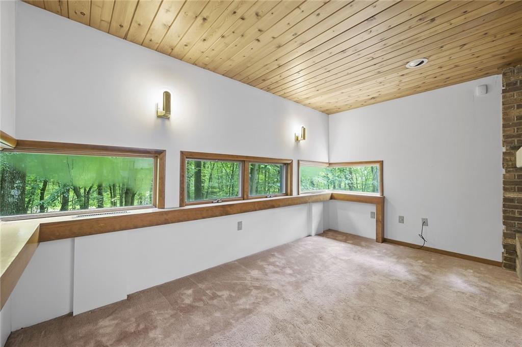958 Blackburn Road Sewickley, PA 15143 - Photo 14 of 49 a view of an empty room with a window and kitchen view