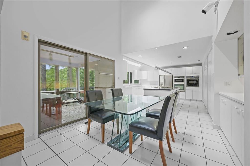 958 Blackburn Road Sewickley, PA 15143 - Photo 18 of 49 a dining room with furniture and large windows