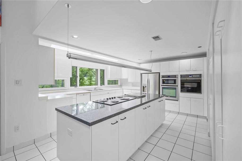 958 Blackburn Road Sewickley, PA 15143 - Photo 21 of 49 a kitchen with stainless steel appliances granite countertop a sink and a stove