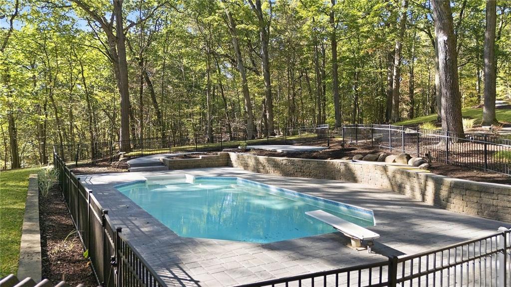 958 Blackburn Road Sewickley, PA 15143 - Photo 49 of 49 a view of a swimming pool with a patio