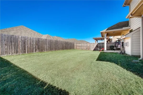 a view of a backyard with a small cabin