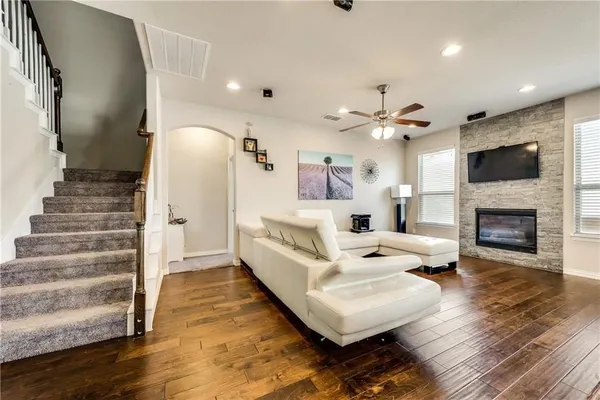 a living room with furniture and a fireplace