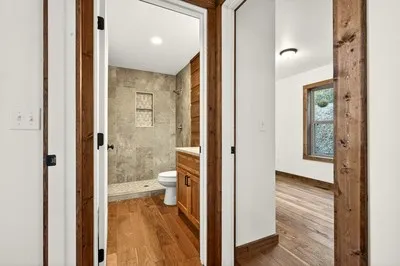 a bathroom with a glass shower door