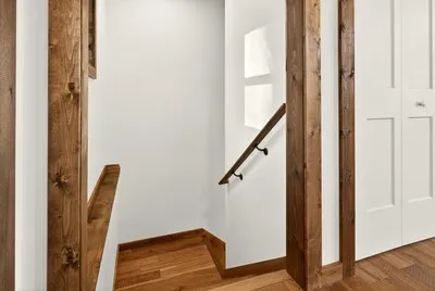 a view of front door with wooden floor