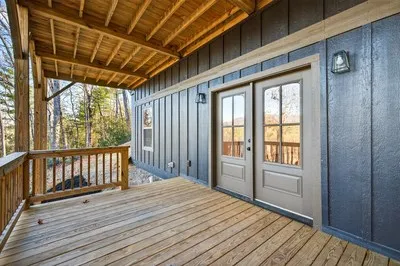 a view of a porch with wooden floor and outdoor space