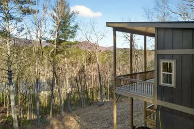 a view of balcony with furniture
