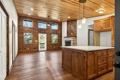 a view of a kitchen with a sink and cabinets