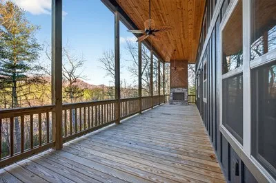 a view of a balcony with wooden floor and stairs
