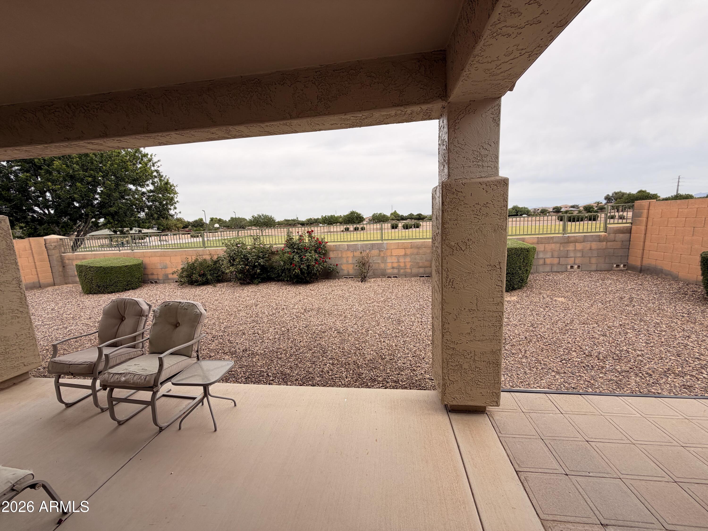 19466 East Reins Road Queen Creek, AZ 85142 - Photo 10 of 10 a swimming pool with outdoor seating and lake view