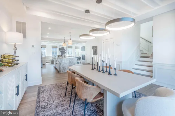 a kitchen with a table and chairs in it
