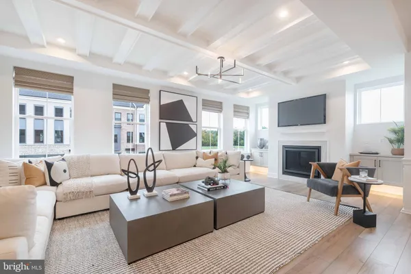 a living room with furniture fireplace and a flat screen tv