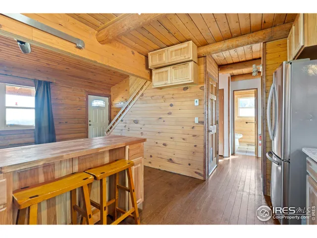 a view of a house with a wooden deck