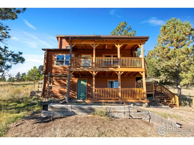 an outdoor view of a house with backyard