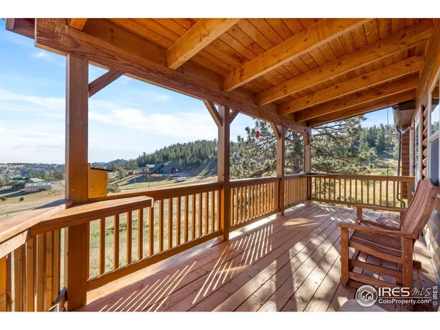 a view of balcony with wooden floor