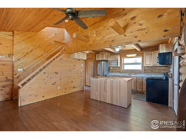 a view of a living room and kitchen