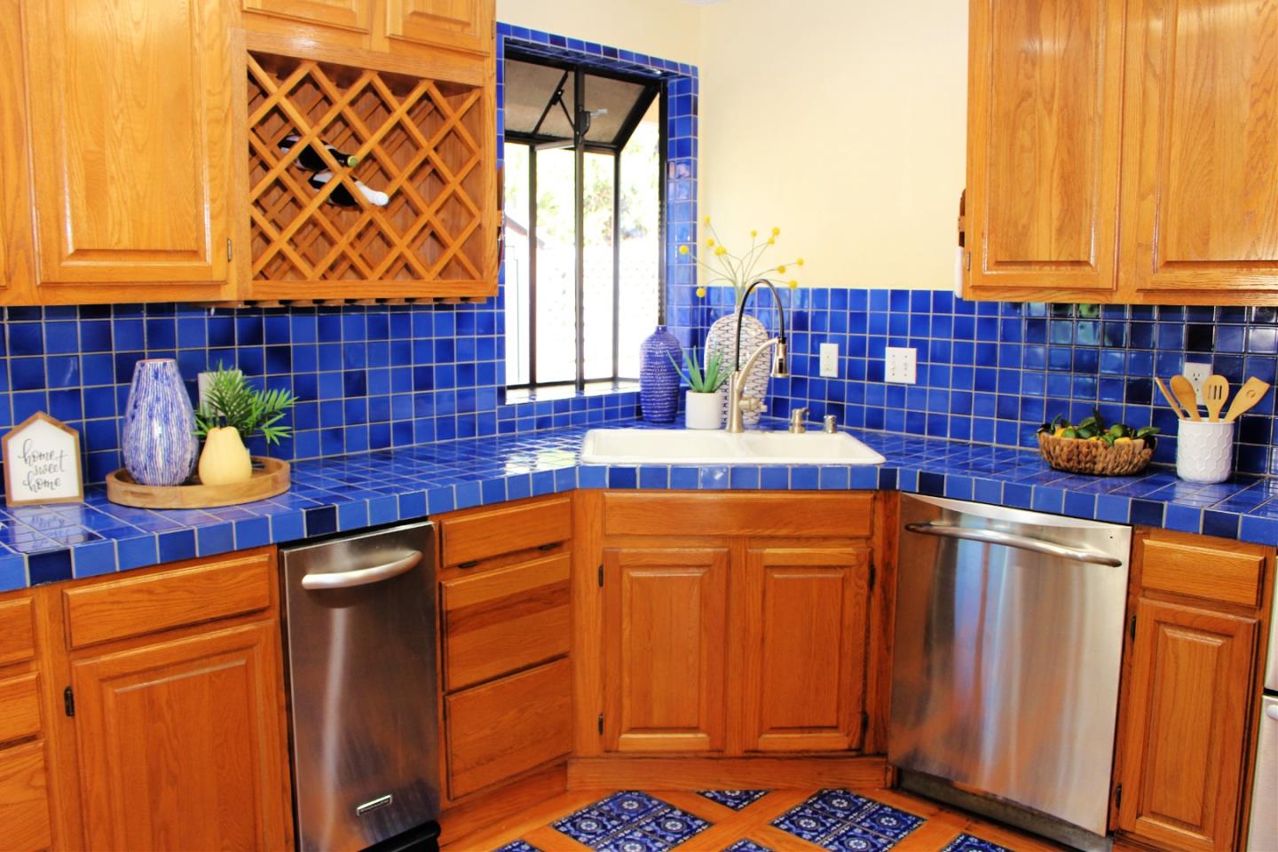 774 Prairie Creek Drive Pacifica, CA 94044 - Photo 12 of 29 a kitchen with stainless steel appliances a sink and a refrigerator