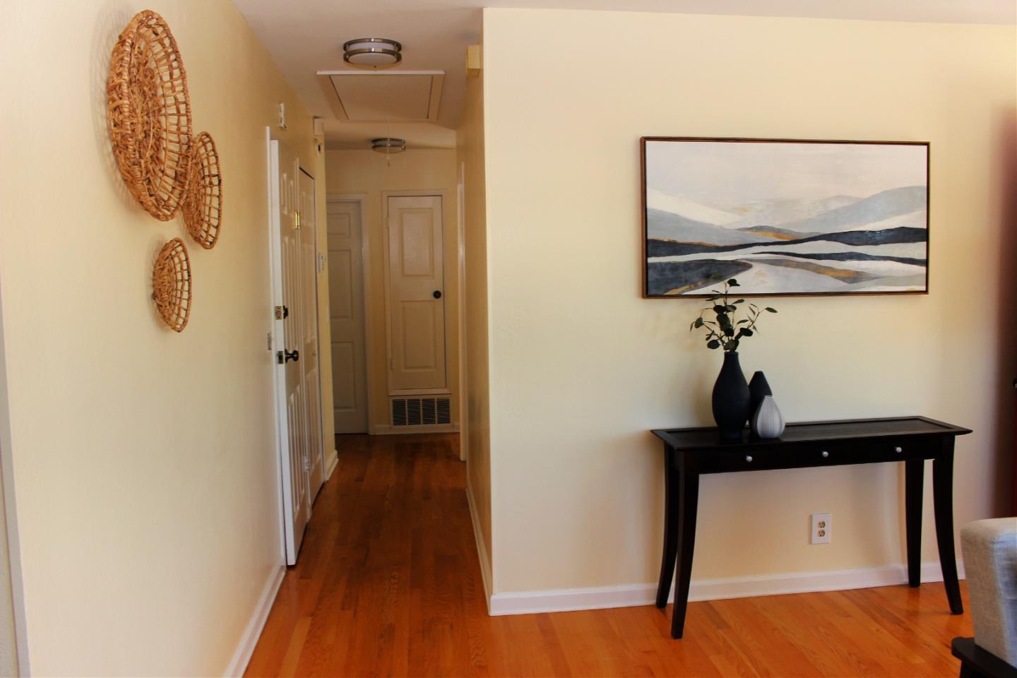 774 Prairie Creek Drive Pacifica, CA 94044 - Photo 15 of 29 a view of a hallway with wooden floor