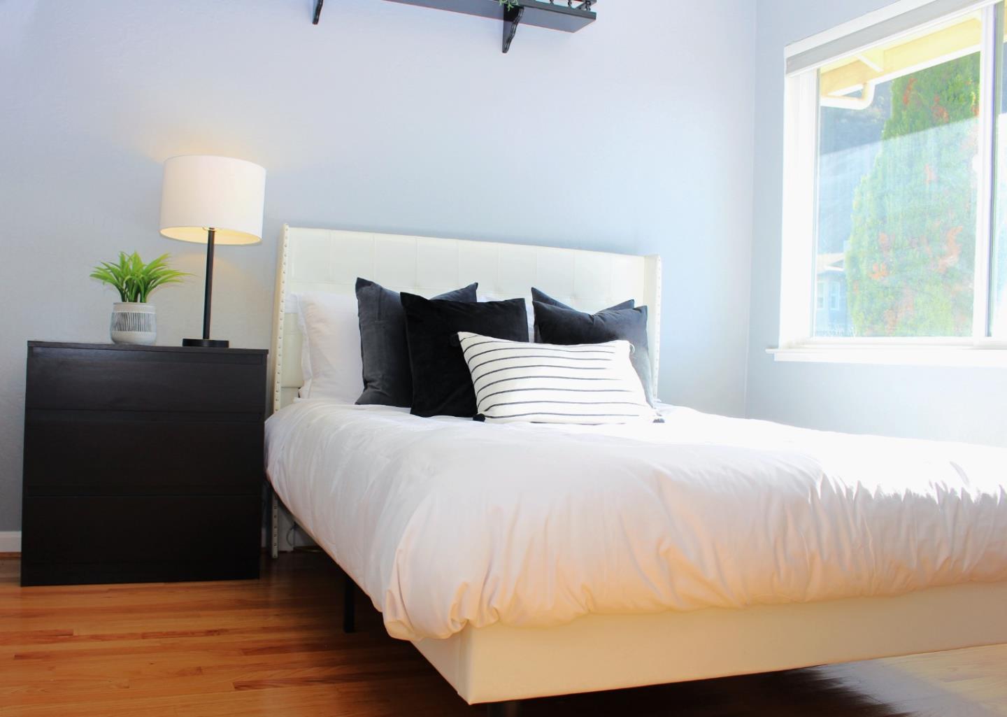 774 Prairie Creek Drive Pacifica, CA 94044 - Photo 16 of 29 a bedroom with bed and window