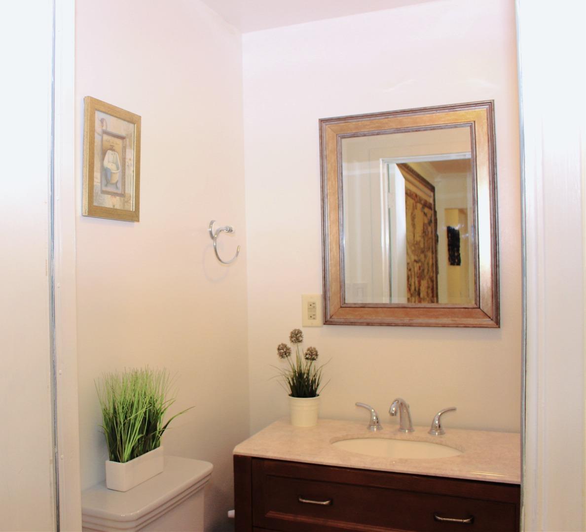 774 Prairie Creek Drive Pacifica, CA 94044 - Photo 19 of 29 a bathroom with a sink a toilet and mirror