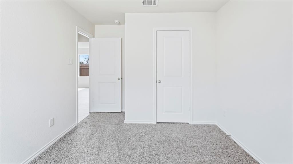 3519 Spring Time Street Forney, TX 75126 - Photo 14 of 37 Interior room featuring light gray carpet flooring, white painted walls, and white baseboards