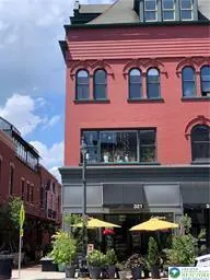 a view of a building with sitting area
