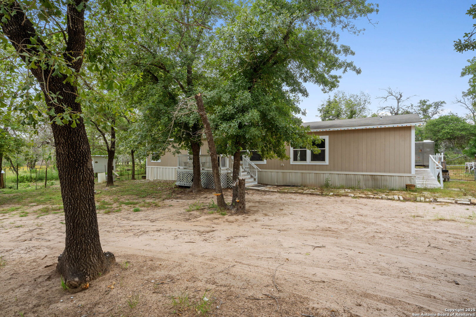 1100 Big Leaf Road San Antonio, TX 78264 - Photo 2 of 26 a house with trees in front of it