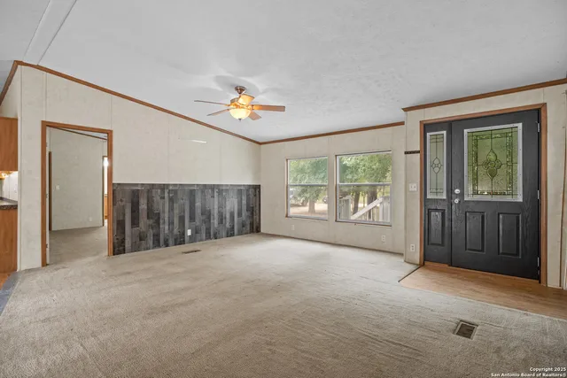 a view of an empty room with a window