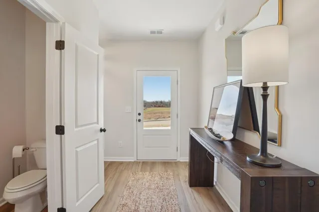 a view of bathroom with a sink and mirror