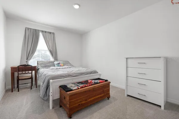 a bedroom with a bed and a shower
