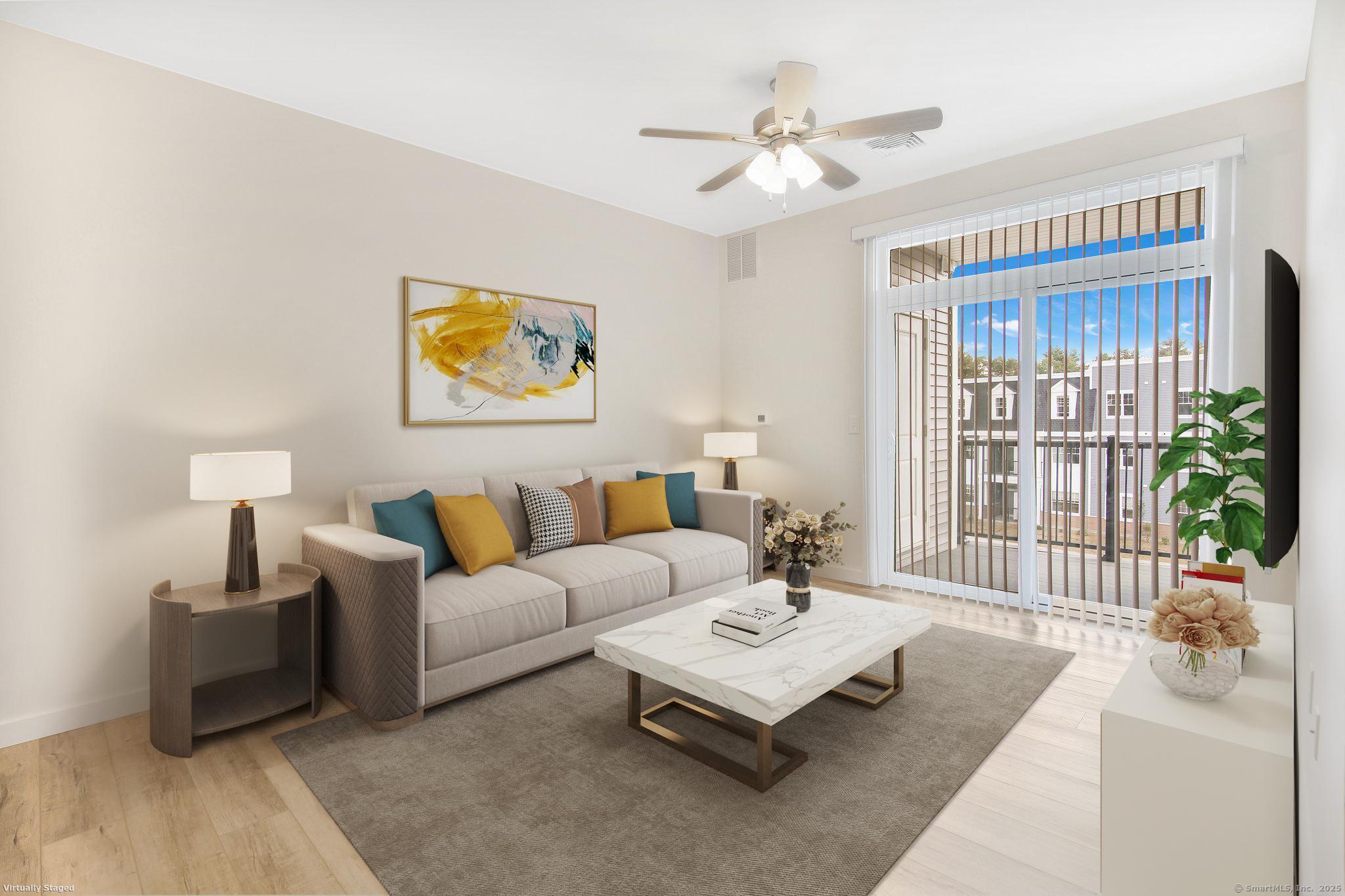 280 Salmon Brook Street, Unit 4311 Granby, CT 06035 - Photo 8 of 26 a living room with furniture and a large window