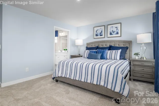 a bedroom with a bed and wall painting