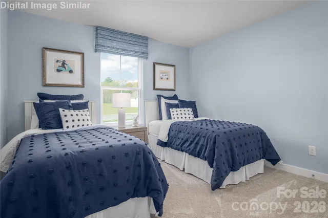 a bedroom with double bed and a window