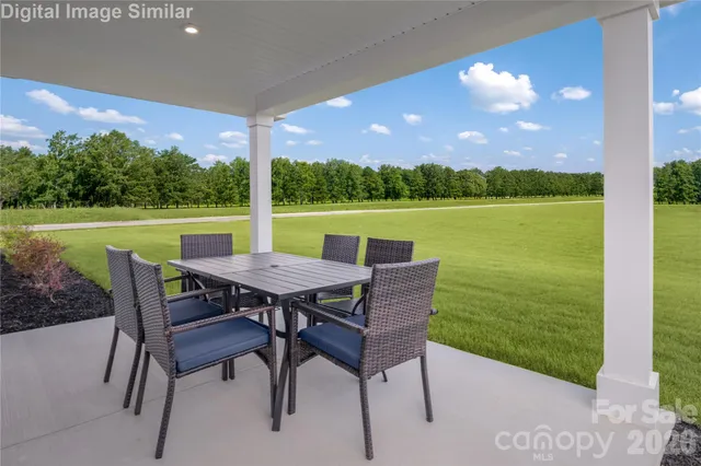 a view of a chairs and table in the patio