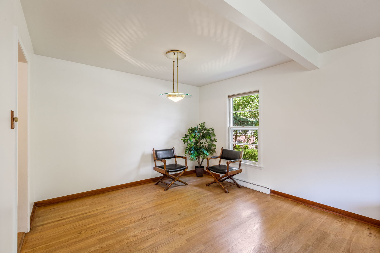 516 Indian Hill Road Deerfield, IL 60015 - Photo 8 of 28 a view of a workspace with furniture and a window