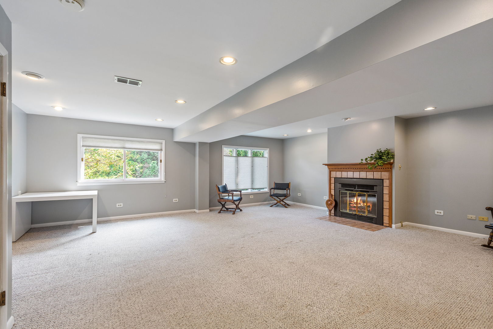 516 Indian Hill Road Deerfield, IL 60015 - Photo 9 of 28 an empty room with furniture and a fireplace