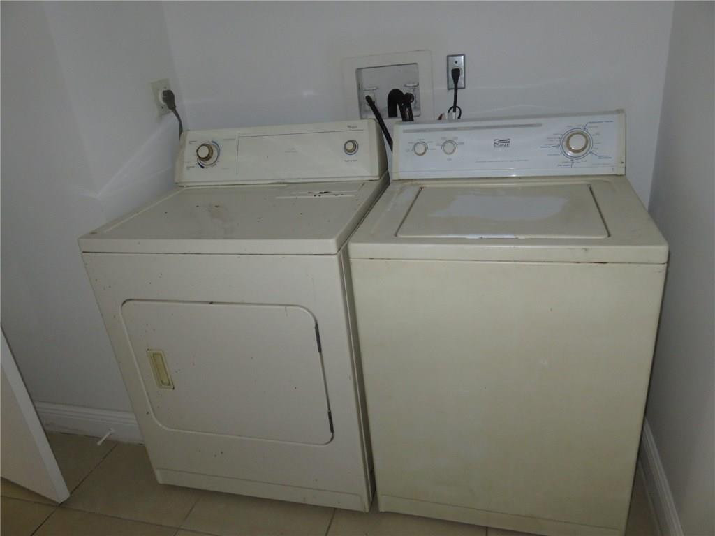 5672 Rock Island Road, Unit 239 Tamarac, FL 33319 - Photo 11 of 16 a utility room with dryer and washer