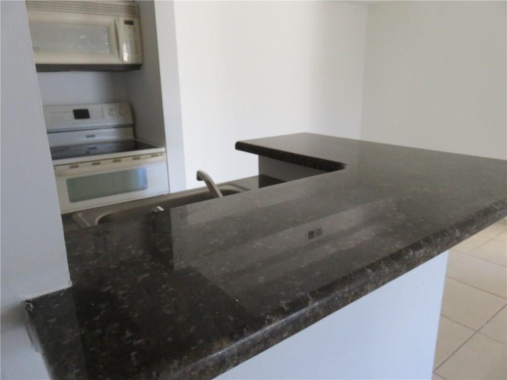 5672 Rock Island Road, Unit 239 Tamarac, FL 33319 - Photo 14 of 16 a close view of sink and cabinets