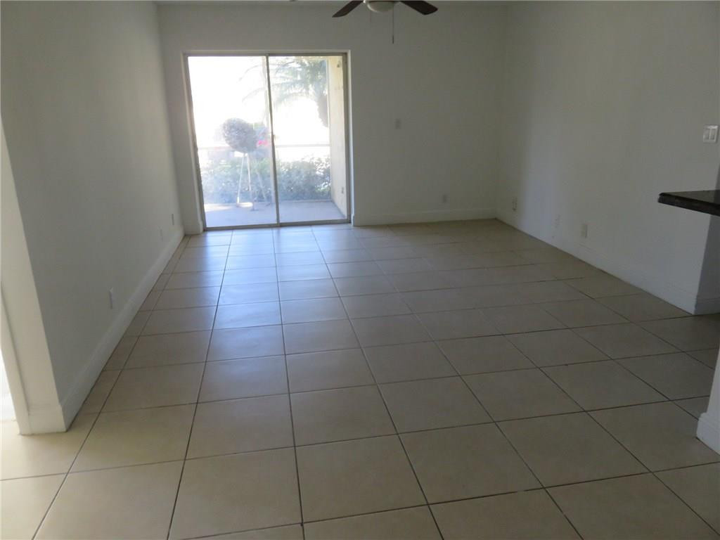 5672 Rock Island Road, Unit 239 Tamarac, FL 33319 - Photo 4 of 16 a view of a livingroom and window