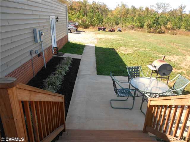 13750 Nash Road Dewitt, VA 23840 - Photo 6 of 24 a view of a backyard with sitting area