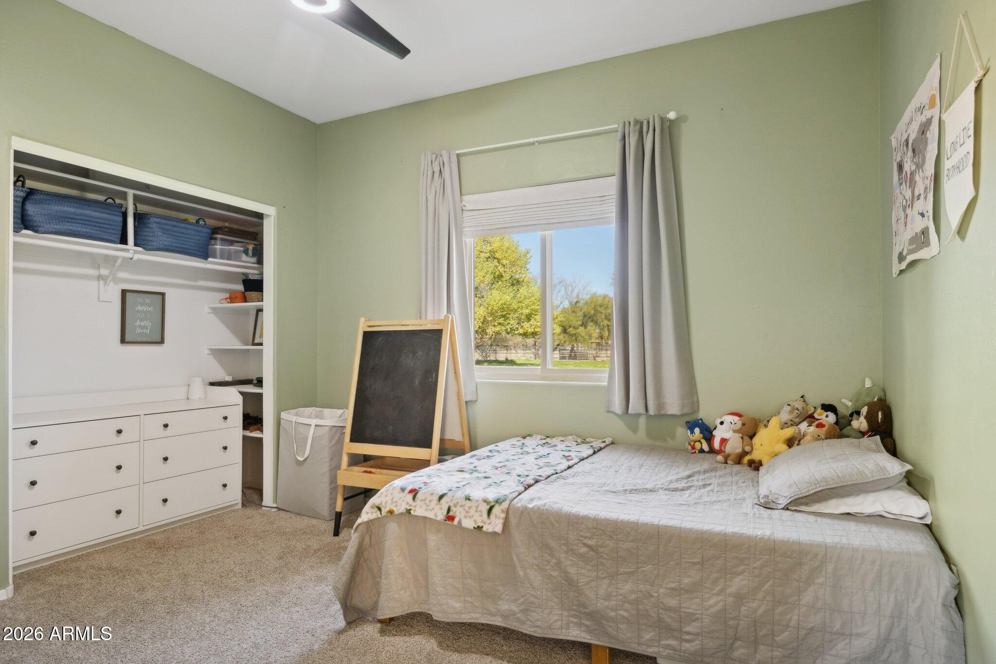 16226 East Fairview Street Gilbert, AZ 85295 - Photo 15 of 59 a bedroom with a bed and a window