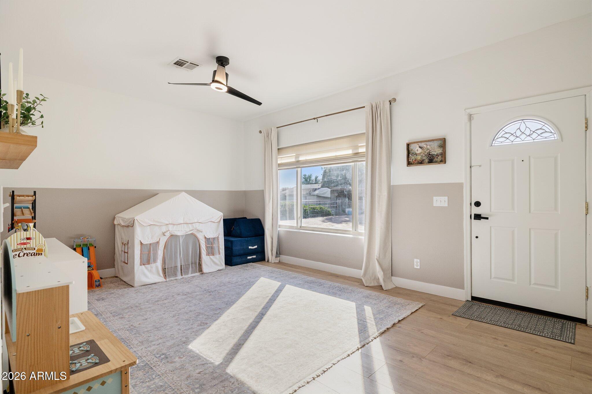 16226 East Fairview Street Gilbert, AZ 85295 - Photo 18 of 59 a living room with furniture and a fireplace