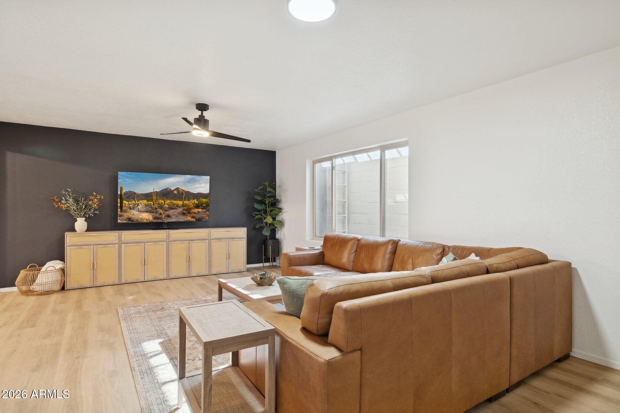 16226 East Fairview Street Gilbert, AZ 85295 - Photo 22 of 59 a living room with furniture and a flat screen tv