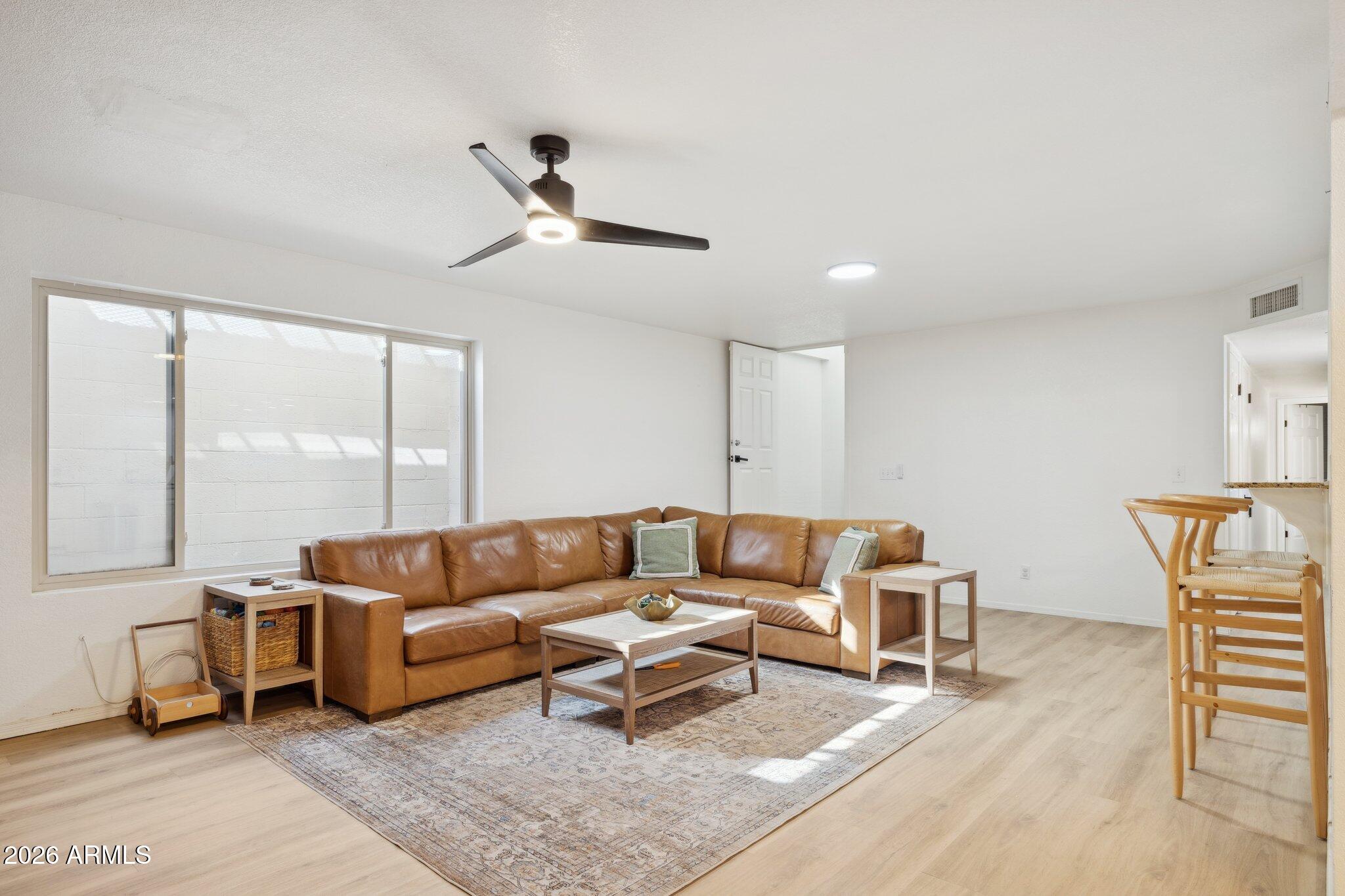 16226 East Fairview Street Gilbert, AZ 85295 - Photo 23 of 59 a living room with furniture a rug and a large window