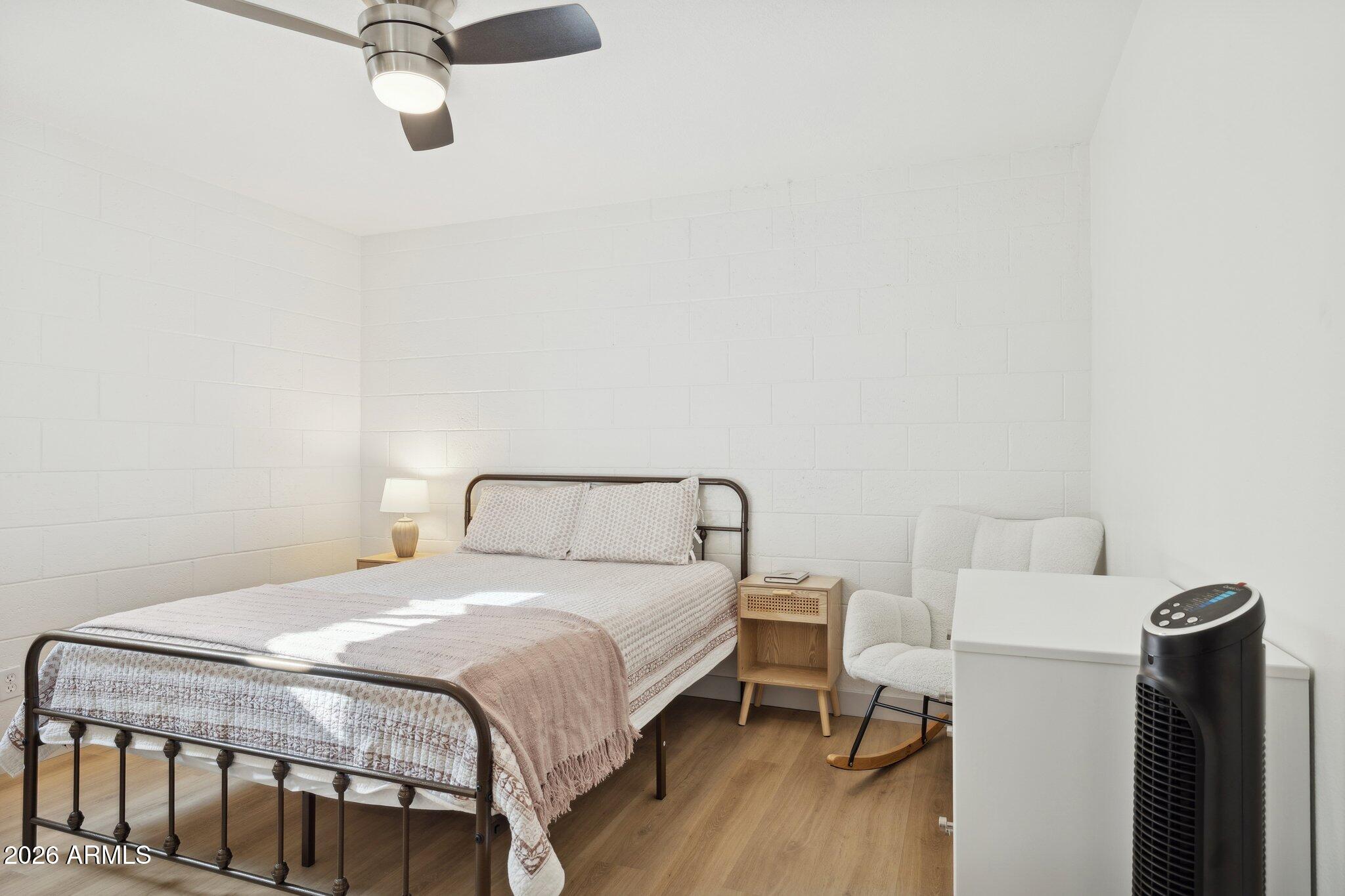 16226 East Fairview Street Gilbert, AZ 85295 - Photo 25 of 59 a bedroom with a bed and a table in it